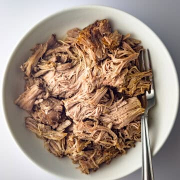 slow cooker kalua pork in white bowl