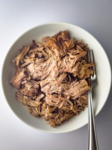 slow cooker kalua pork in white bowl