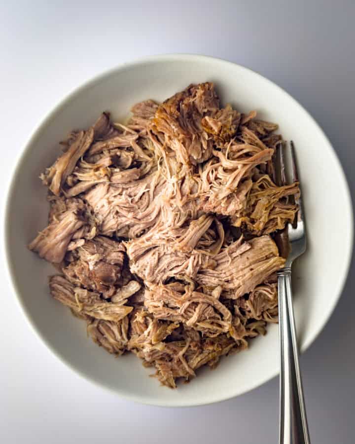 slow cooker kalua pork in white bowl