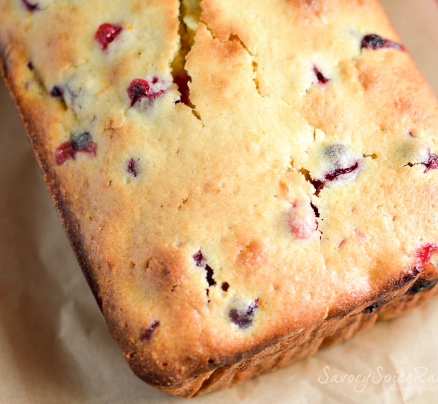 Overhead on the Homemade Cranberry Orange Bread presented on a piece of parchment paper