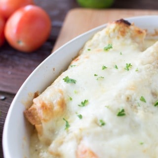 Closeup on the delicious White Sauce Enchiladas with Salsa Verde served in a white plate