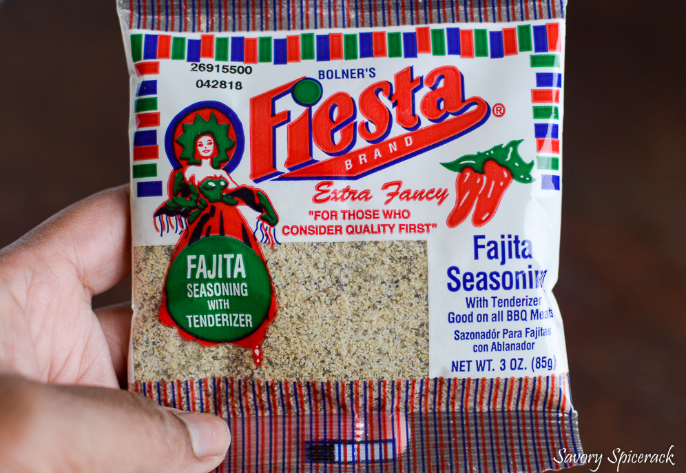 Holding a pack of fajita seasoning in the left hand