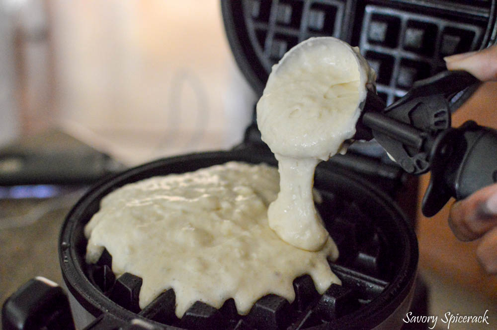 Adding batter to the greased waffle maker