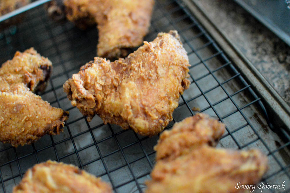 Buttermilk Fried Chicken placed on a cooking rack to rest