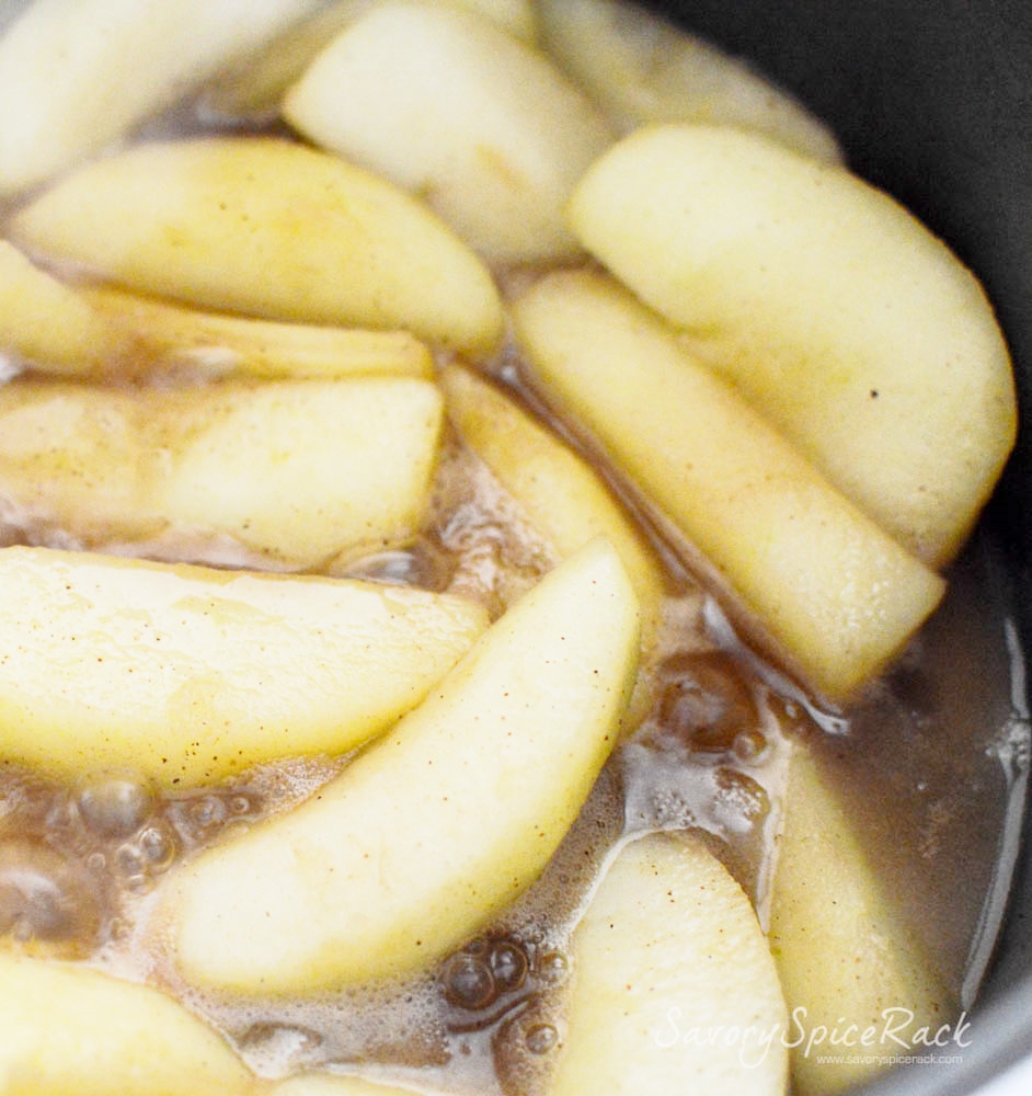 Cooking apples in a saucepan in brandy mixed with other ingredients to make the most delicious Brandied Cinnamon Apples (Cinnamon Apples with Brandy)
