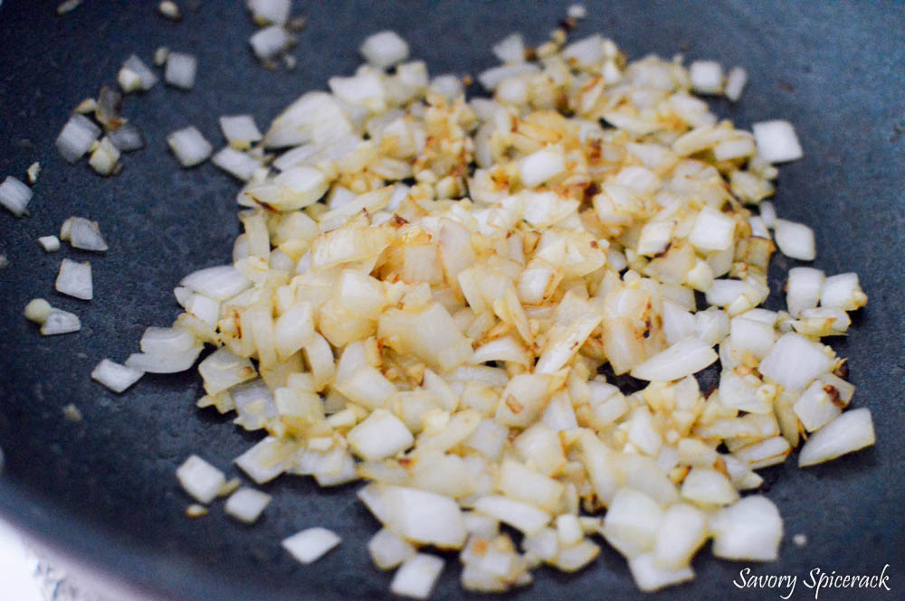 Frying onions in a big pan until golden.