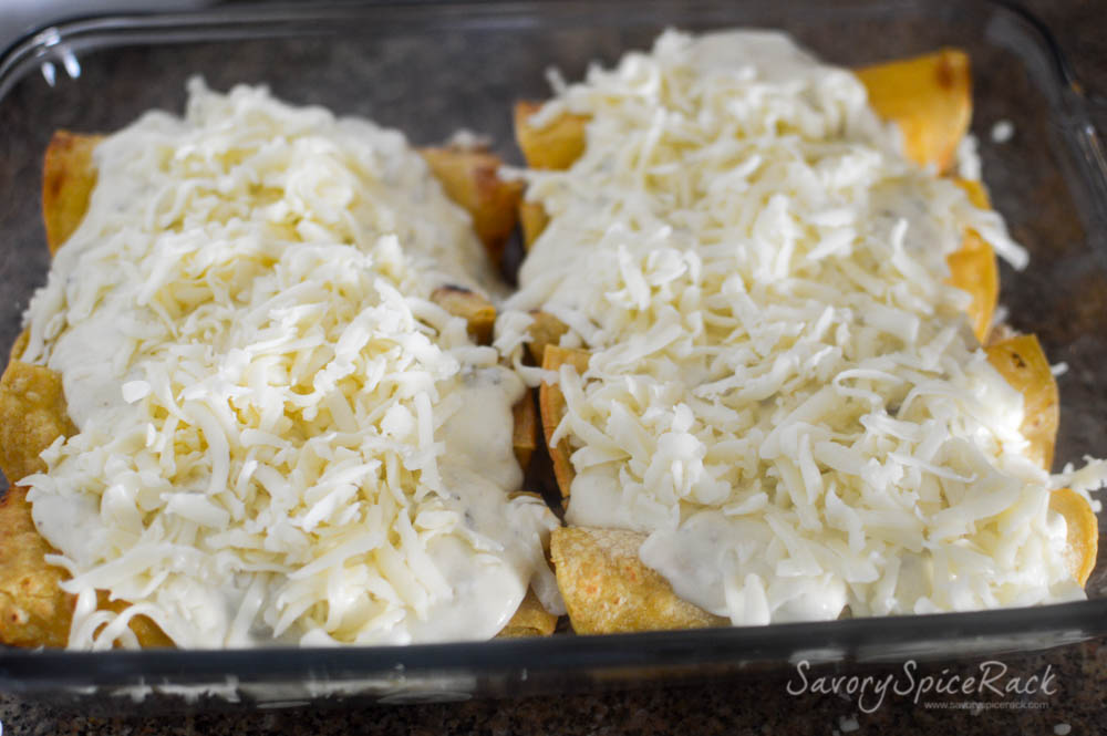 Enchiladas with White Sauce and cheese on top