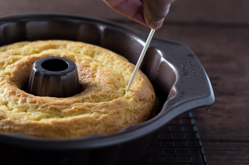poking holes in cake to add sauce